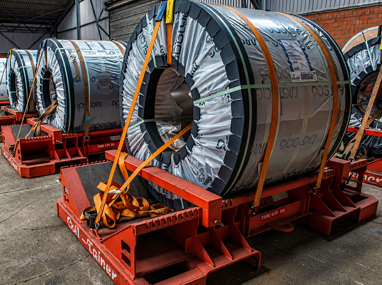 Steel coils secured in a warehouse